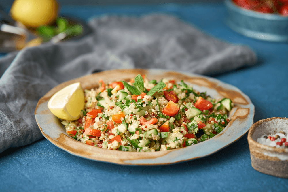 Salad with quinoa, cucumber, tomato and lemon