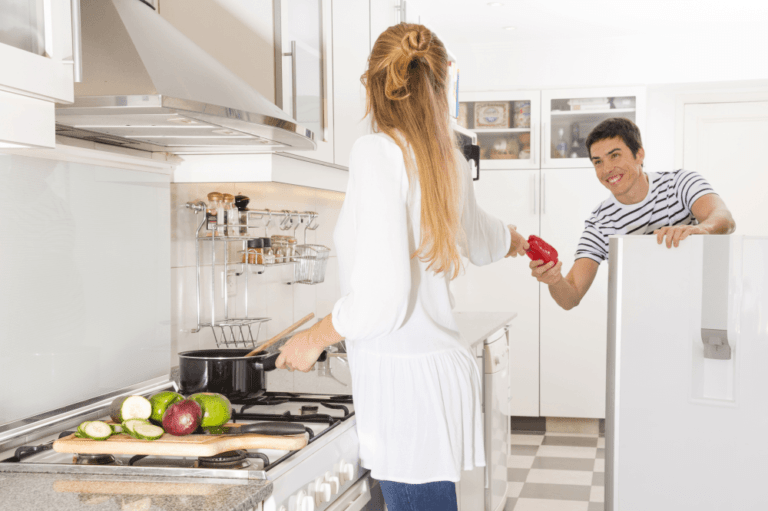 Young couple preparing lunch in the kitchen