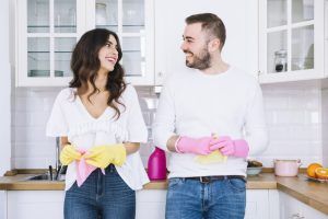 Young couple ready to clean the house